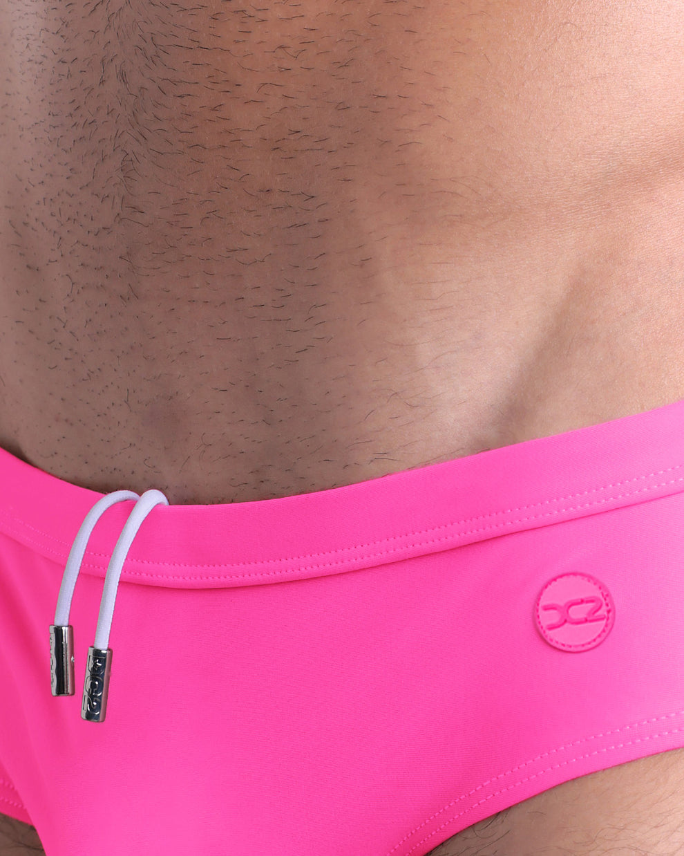 DC2 Pink Bomb Swim Brief — close-up of front waistband with drawstring detail and tonal logo.