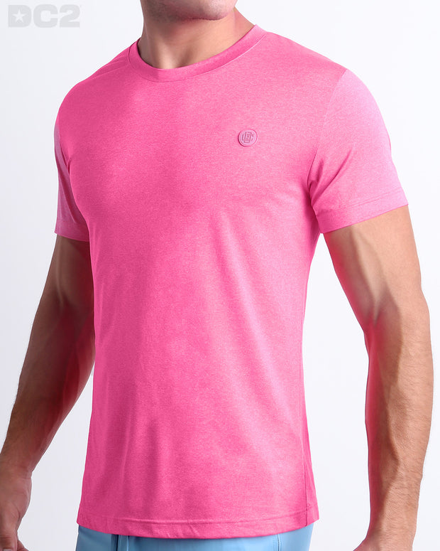 Side view of men’s performance exercise top in a bright pink color made by DC2 the official brand of mens sportswear.