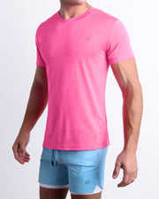 Side view of a male model wearing the PINKTENSITY Fitness T-Shirt with the SKY BLUE Endurance Shorts Lines for men by DC2 a BANG! Miami Clothes capsule brand.
