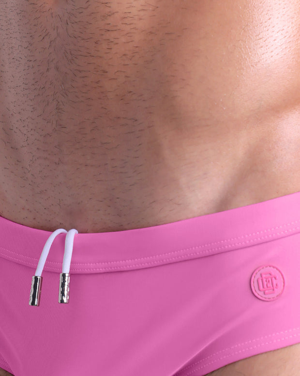 Close-up view of the PINKTYQUE men’s drawstring briefs showing white cord with custom branded metallic silver cord ends, and matching custom eyelet trims in silver.