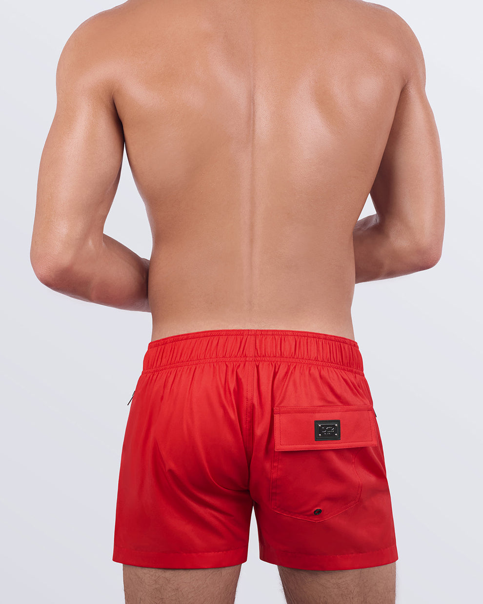 A back view of the PRIME RED - Flex Shorts, showcasing the elasticated back waistband, secure flap pocket, and water-resistant design.