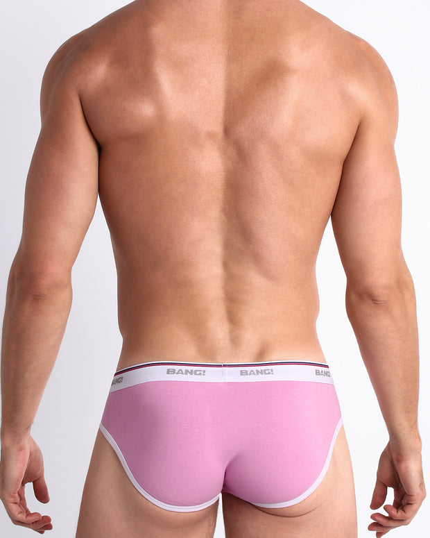 Back view of model wearing the PRIVATE PINK from the Retro line Men’s breathable cotton briefs in a light baby pink color for men by BANG! Offers light compression for perfect contouring to the body and second-skin fit.