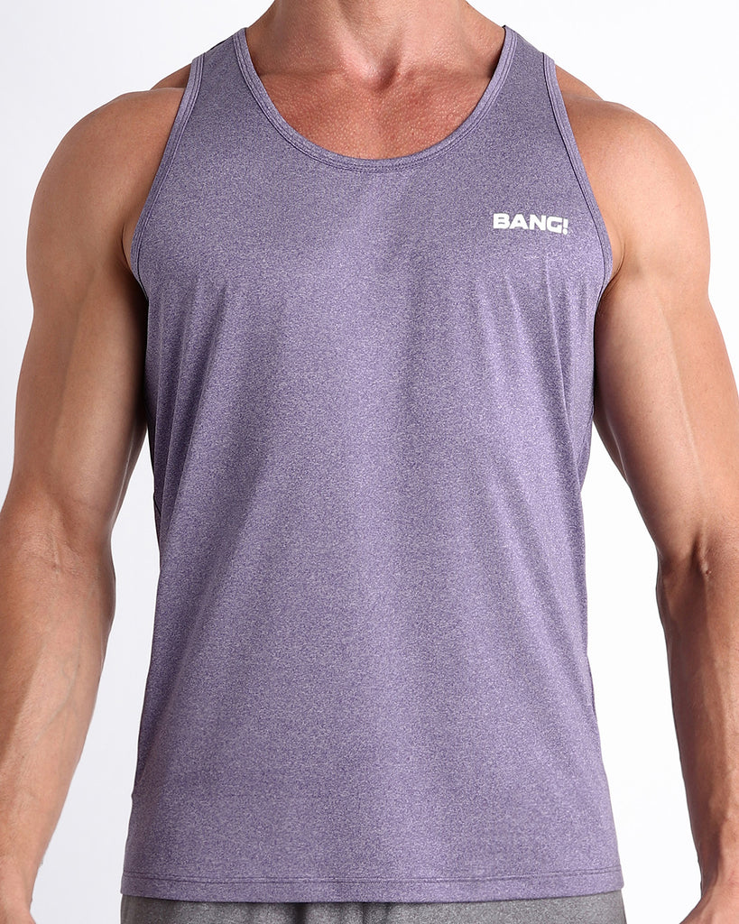 Frontal view of male model wearing the PURPLE MARVEL in a solid marbled purple color gym tank top for men by the Bang! brand of men's beachwear from Miami.