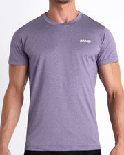 Frontal view of male model wearing the PURPLE MARVEL in a solid marbled purple color quick-dry workout shirt by the Bang! brand of men's beachwear from Miami.