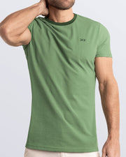 Frontal view of a male model wearing a light green Pima cotton t-shirt with a bold forest green collar, crafted for stylish casual wear and beachwear by DC2 Miami. Premium quality men's streetwear t-shirt, perfect fit for summer fashion.