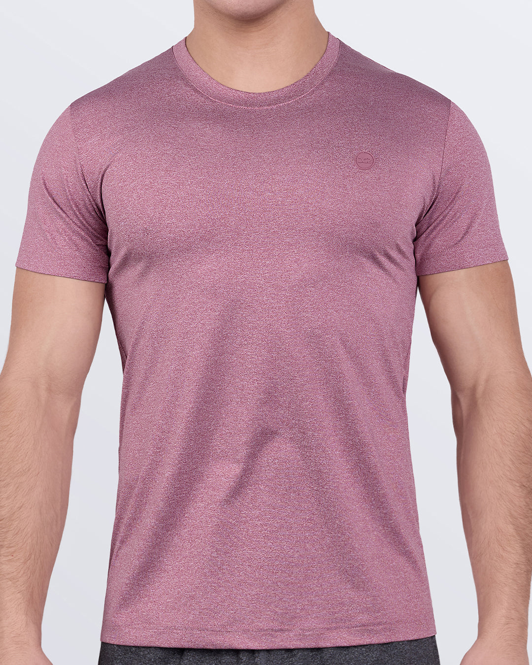 DC2 RIPPED CRIMSON Fitness T-Shirt — model wearing short-sleeve athletic shirt in a crimson-red heather tone, designed for performance workouts.