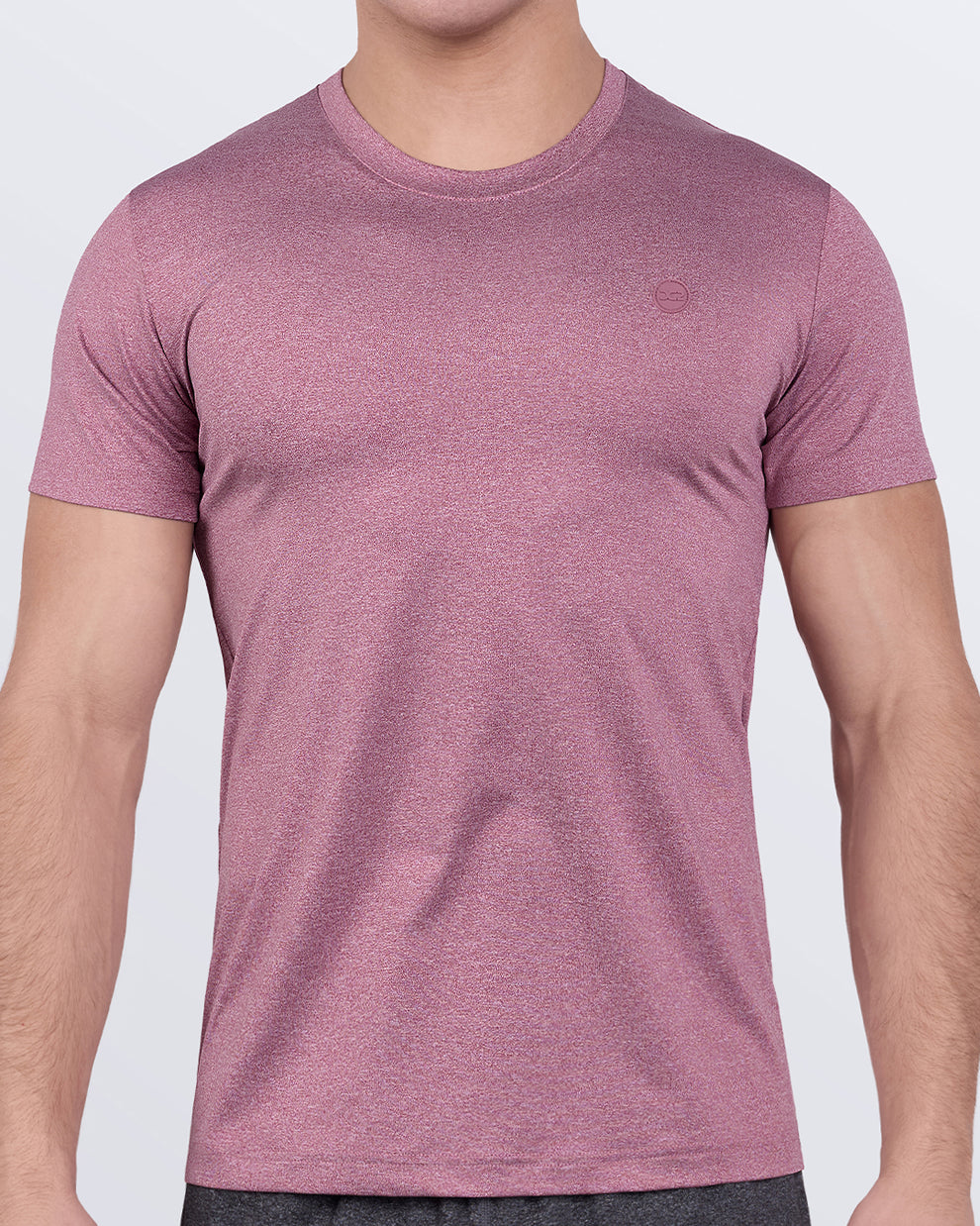 DC2 RIPPED CRIMSON Fitness T-Shirt — model wearing short-sleeve athletic shirt in a crimson-red heather tone, designed for performance workouts.