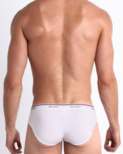 Back view of model wearing the RISKY WHITE from the Retro line Men’s breathable cotton briefs for men by BANG! Offers light compression for perfect contouring to the body and second-skin fit.