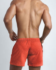 Back view of the ROCKY ORANGE men's fitness sweatshorts in a orange color by BANG! menswear Miami.