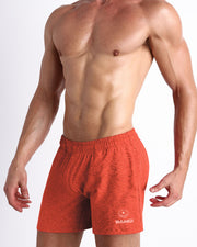Side view of men’s performance exercise shorts in a Marbled Orange color made by BANG! Clothing the official brand of mens sportswear.
