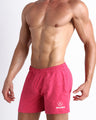 Side view of men’s performance exercise shorts in a Marbled Neon Pink color made by BANG! Clothing the official brand of mens sportswear.