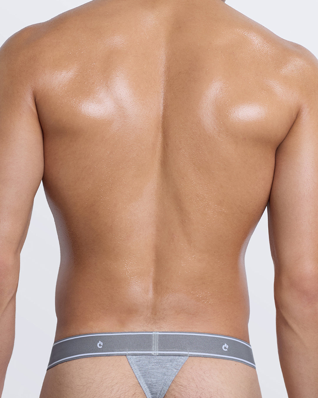 DC2 Modal Thong — back view in grey with minimal thong coverage and tonal elastic band with logo detail.