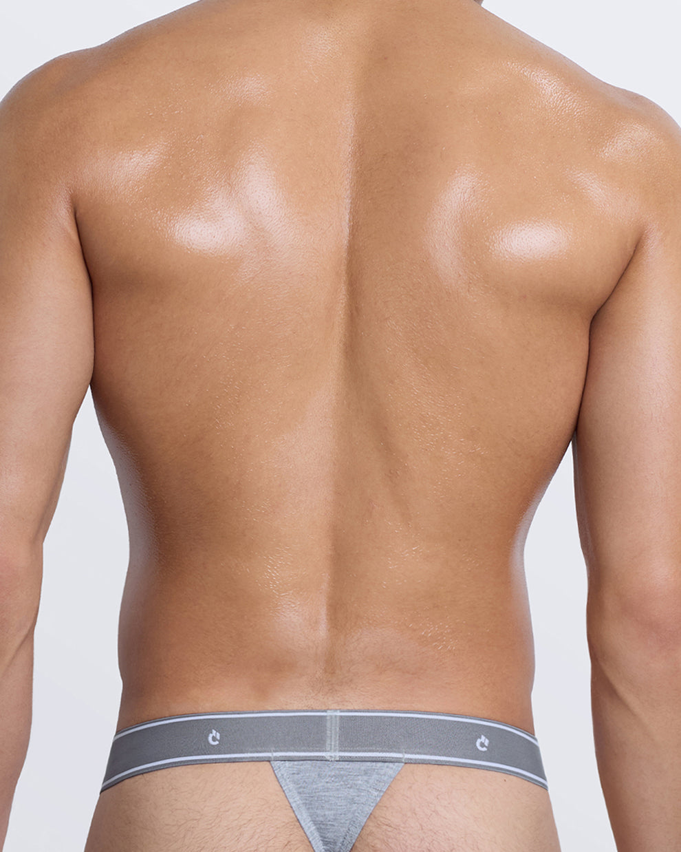 DC2 Modal Thong — back view in grey with minimal thong coverage and tonal elastic band with logo detail.
