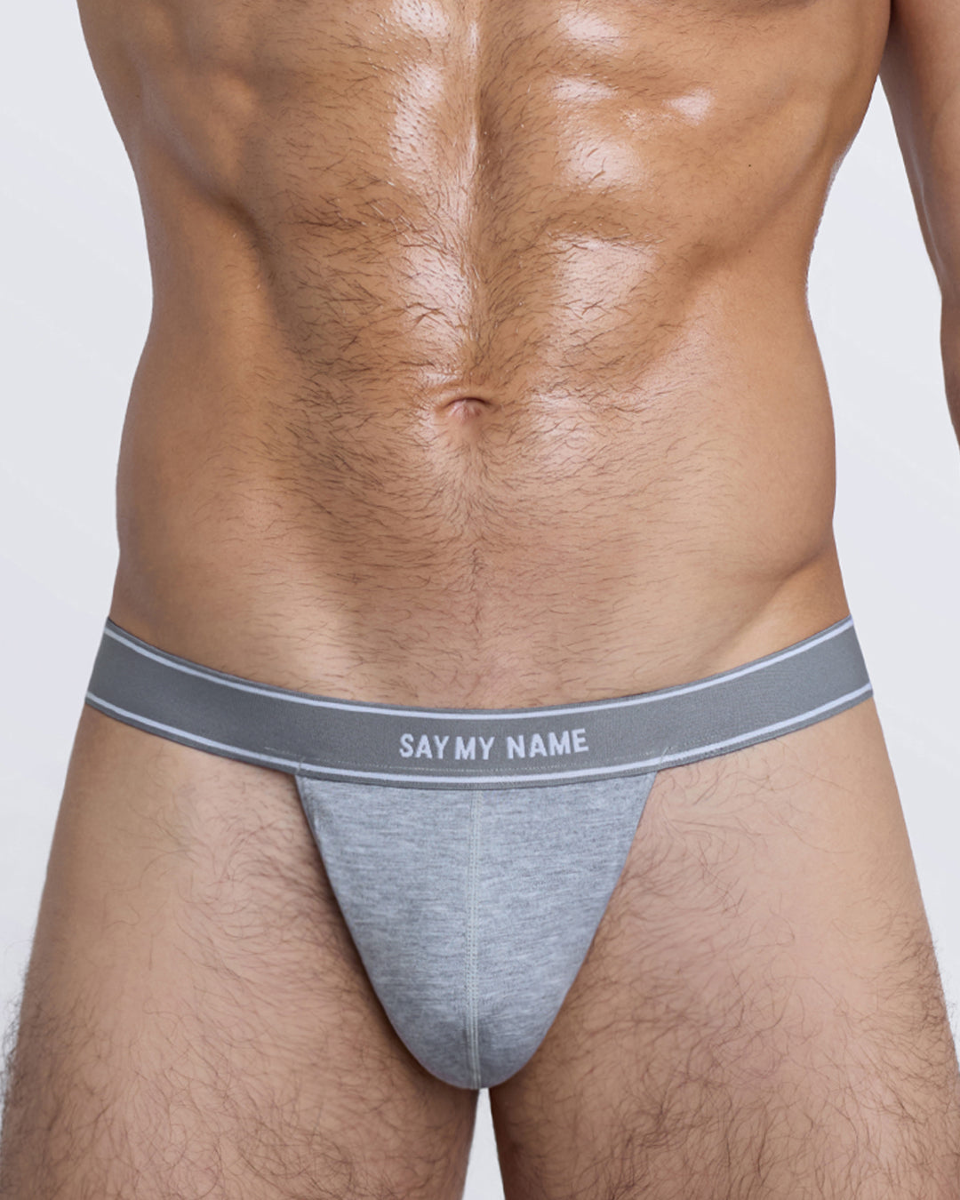 SAY MY NAME Modal Thong by DC2 — close-up of front pouch in soft heather grey modal with bold branded band.