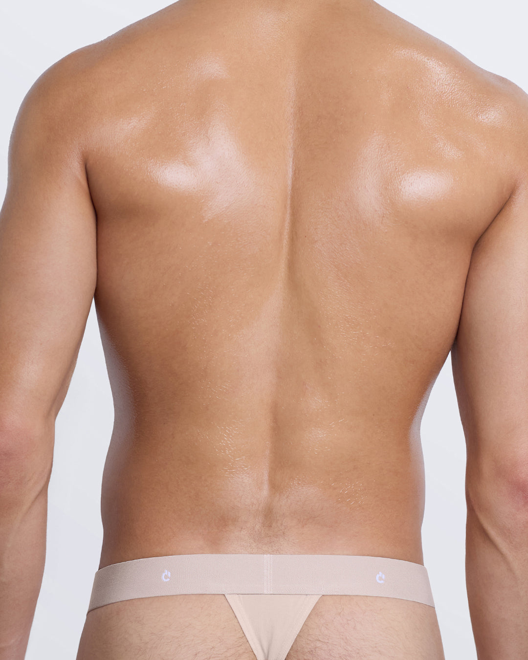 DC2 Modal Thong — back view in beige featuring sleek thong fit and tonal elastic waistband with DC2 logo.