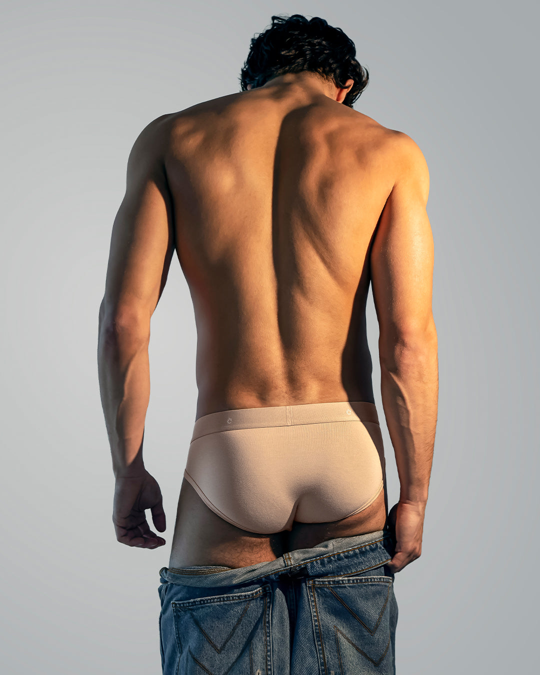 DC2 Simply Irresistible modal briefs in soft beige worn by male model, lightweight men’s underwear offering a smooth feel and clean, modern fit.