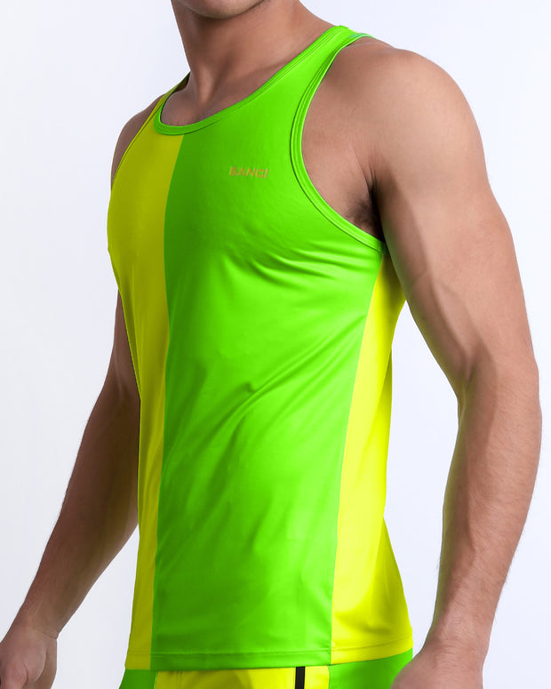 Side view of the SINGLE BILINGUAL (NEON YELLOW/GREEN) men’s summer Tank Top. The casual tank top is vibrant with fluorescent colors, a bright lime green hue on the left side, and a yellow shade on the right made by BANG! Clothes in Miami.