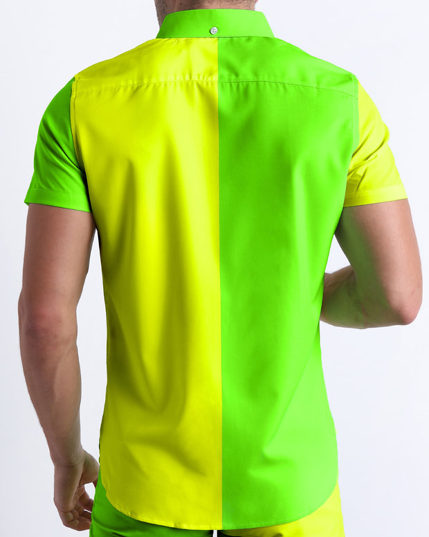 Male model wearing men’s SINGLE BILINGUAL (NEON YELLOW/GREEN) men’s Summer button-down in a bright fluorescent yellow and green color block design by designed by BANG! Clothes in Miami.