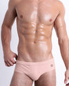 DC2 Skinny Dip (Fair/Naked Pink) Swim Brief — front view showing sleek low-rise fit and sculpted pouch.