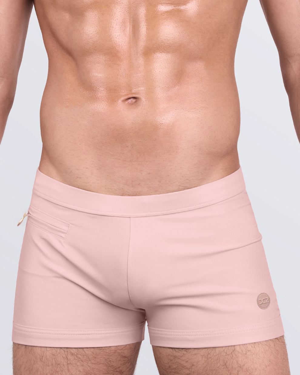 DC2 SKINNY DIP (FAIR) Swim Trunks — close-up front angle highlighting the smooth fabric and logo detail.