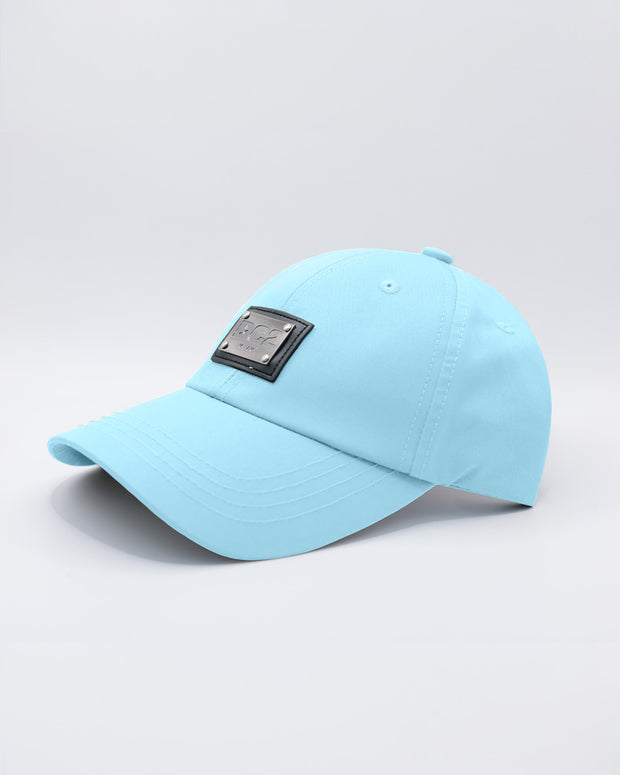 Close-up of a SKY BLUE Baseball Cap with polished DC2 metallic silver plaque.