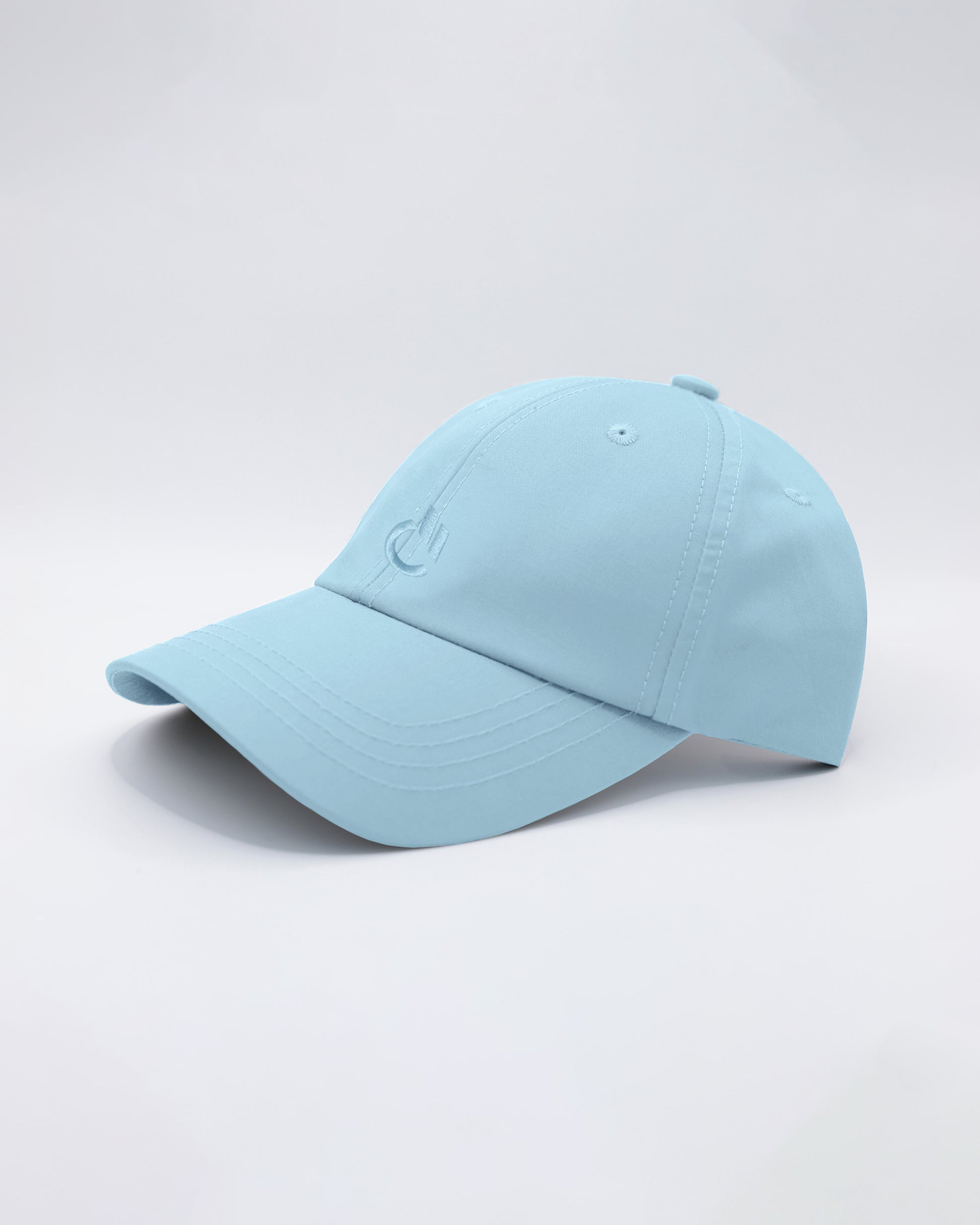 DC2 Sky Blue Resort Cap — angled view emphasizing the curved brim, clean stitching, and tonal DC2 embroidery.