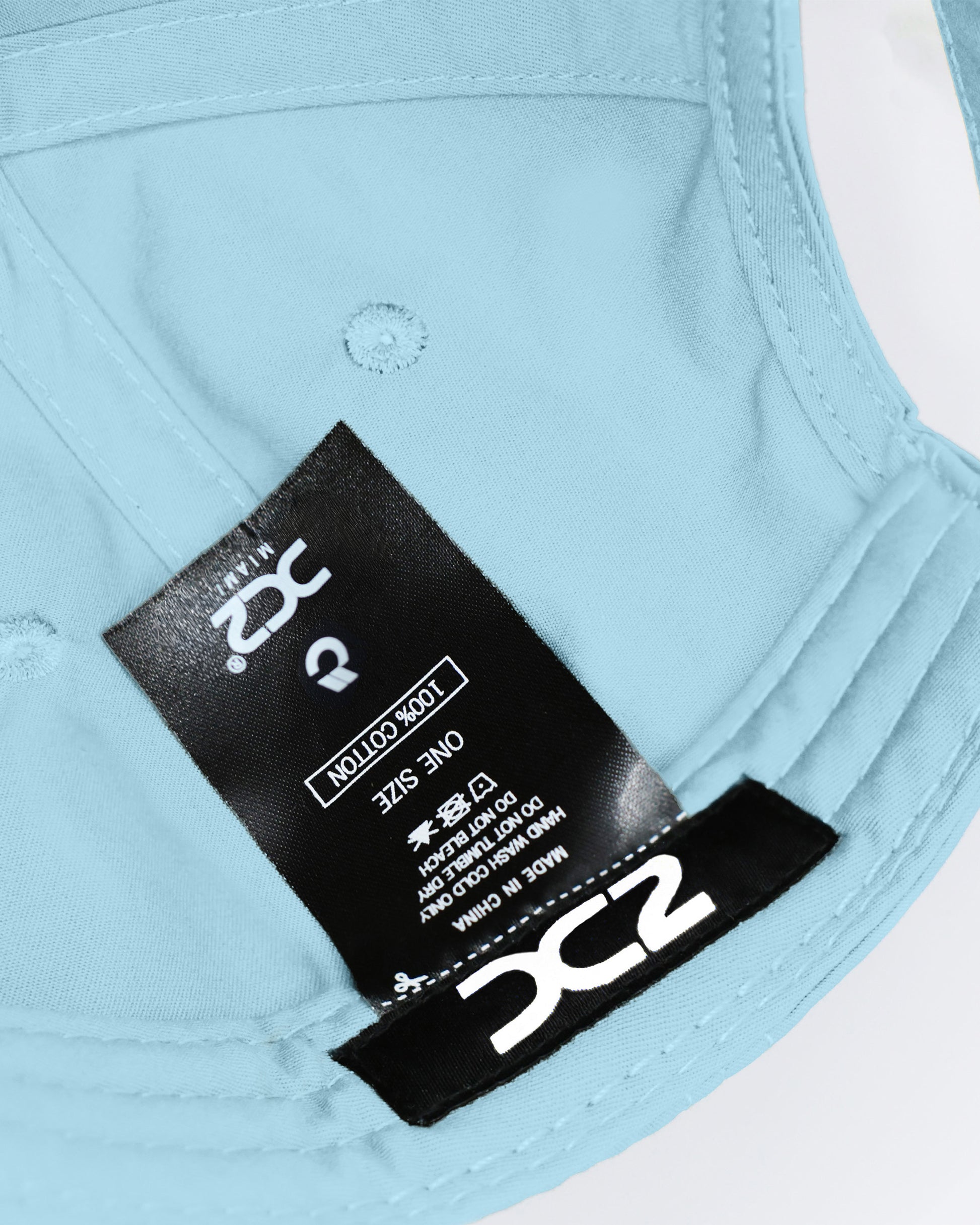 Interior view of the DC2 Sky Blue Resort Cap — showing soft cotton lining, branded label, and adjustable construction.