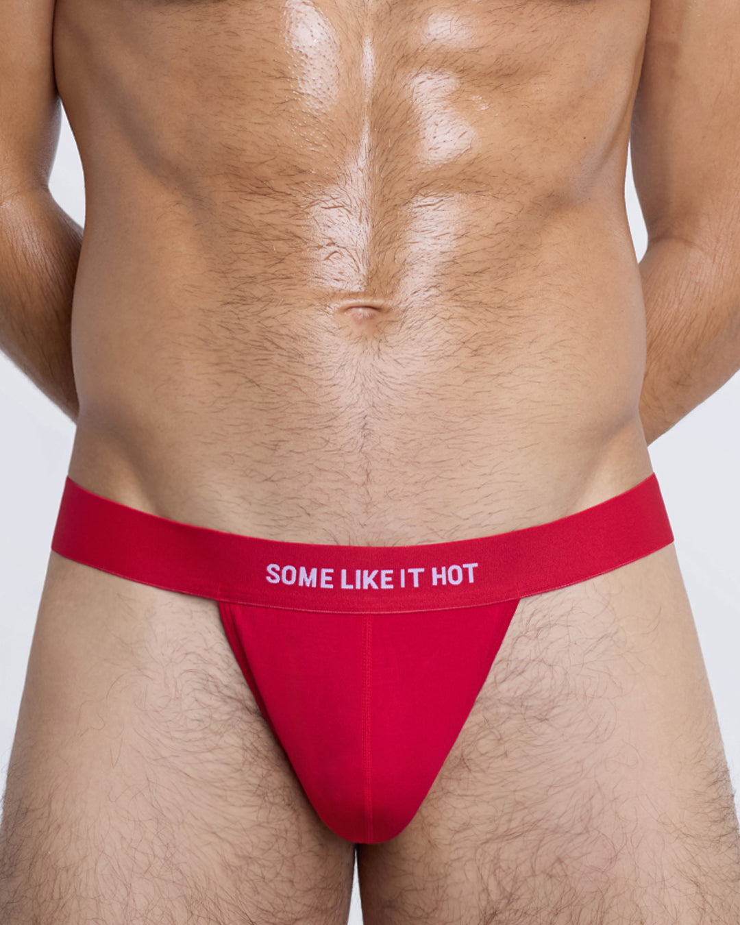 SOME LIKE IT HOT Modal Thong by DC2 — close-up front pouch in red with bold text on elastic waistband.