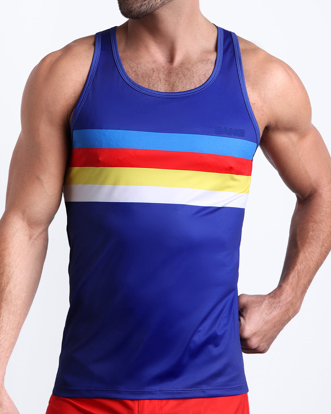 Frontal view of model wearing Stripe'A'Pose men’s tank top by the Bang! Clothes brand of men's beachwear from Miami.