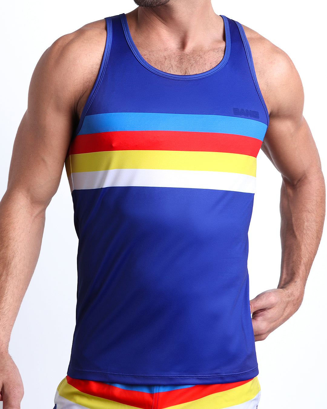 Frontal view of model wearing Stripe'A'Pose men’s tank top by the Bang! Clothes brand of men's beachwear from Miami.