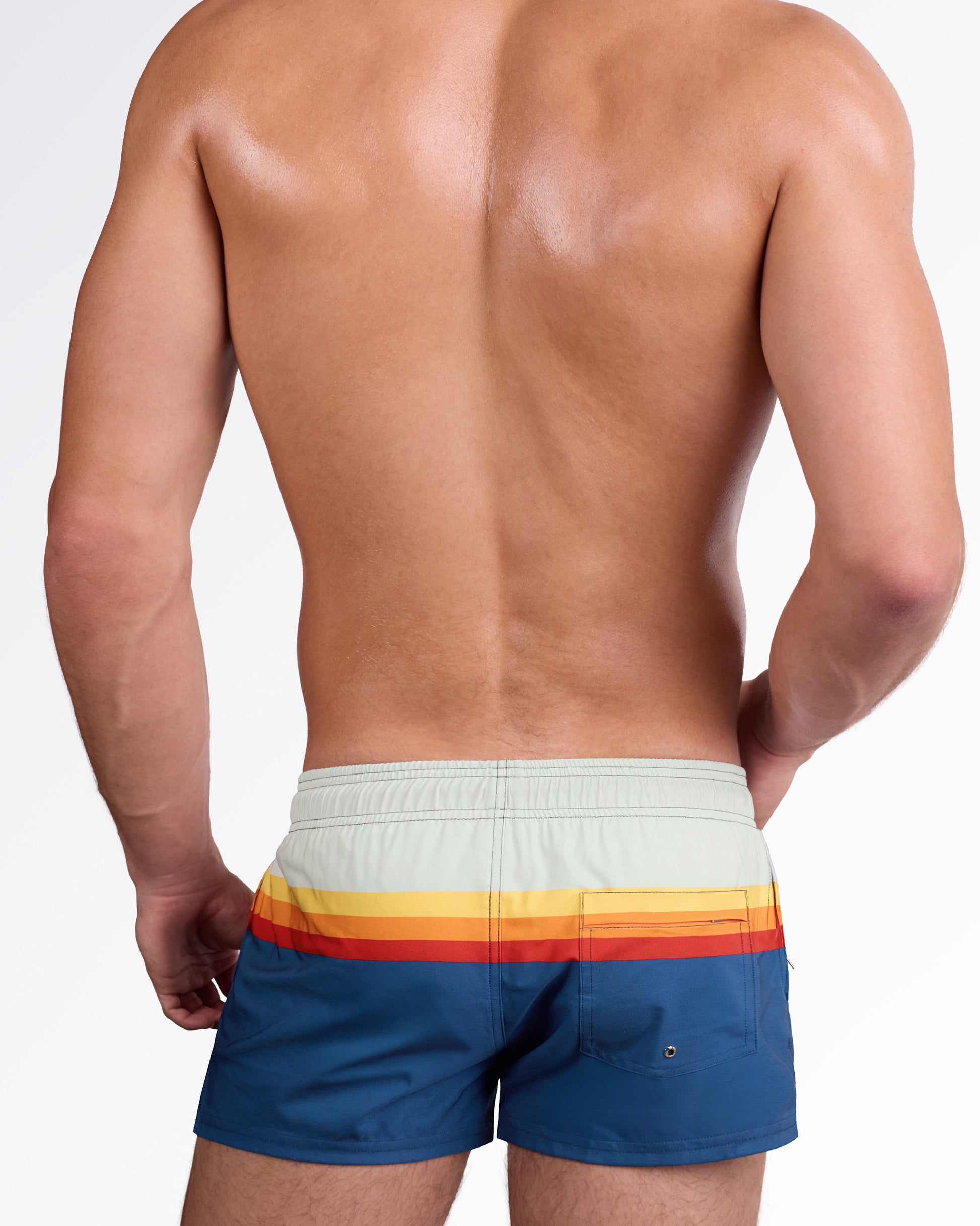DC2 Sunset Stripes Poolside Shorts — back view highlighting the horizontal sunset stripe pattern and rear pocket detail on the blue swim shorts.