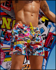 SUPER POP Summer resort shorts with dual pockets for men feature a fun and energetic comics-style graphics in bold colors with a prominent BANG! Sign by Bang! Clothing of Miami.