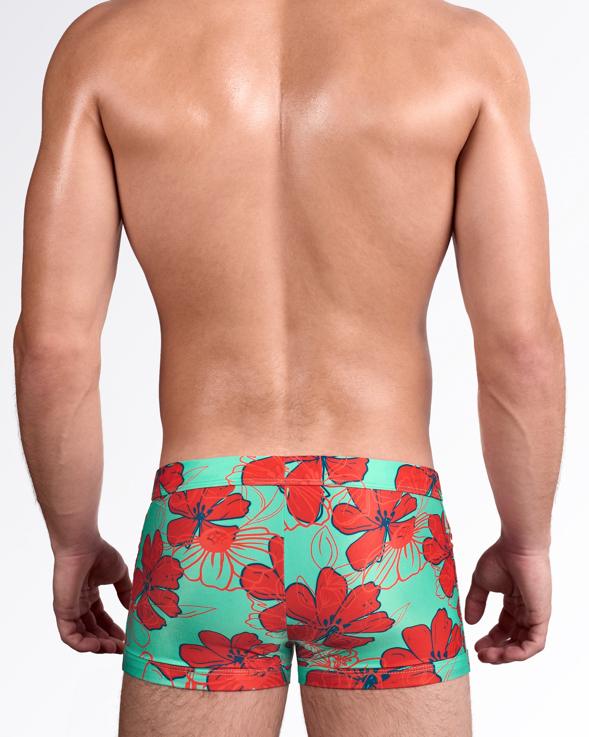 BANG Surf Flowers Aqua Red Swim Trunks — back view showing full aqua background with large red floral print coverage.