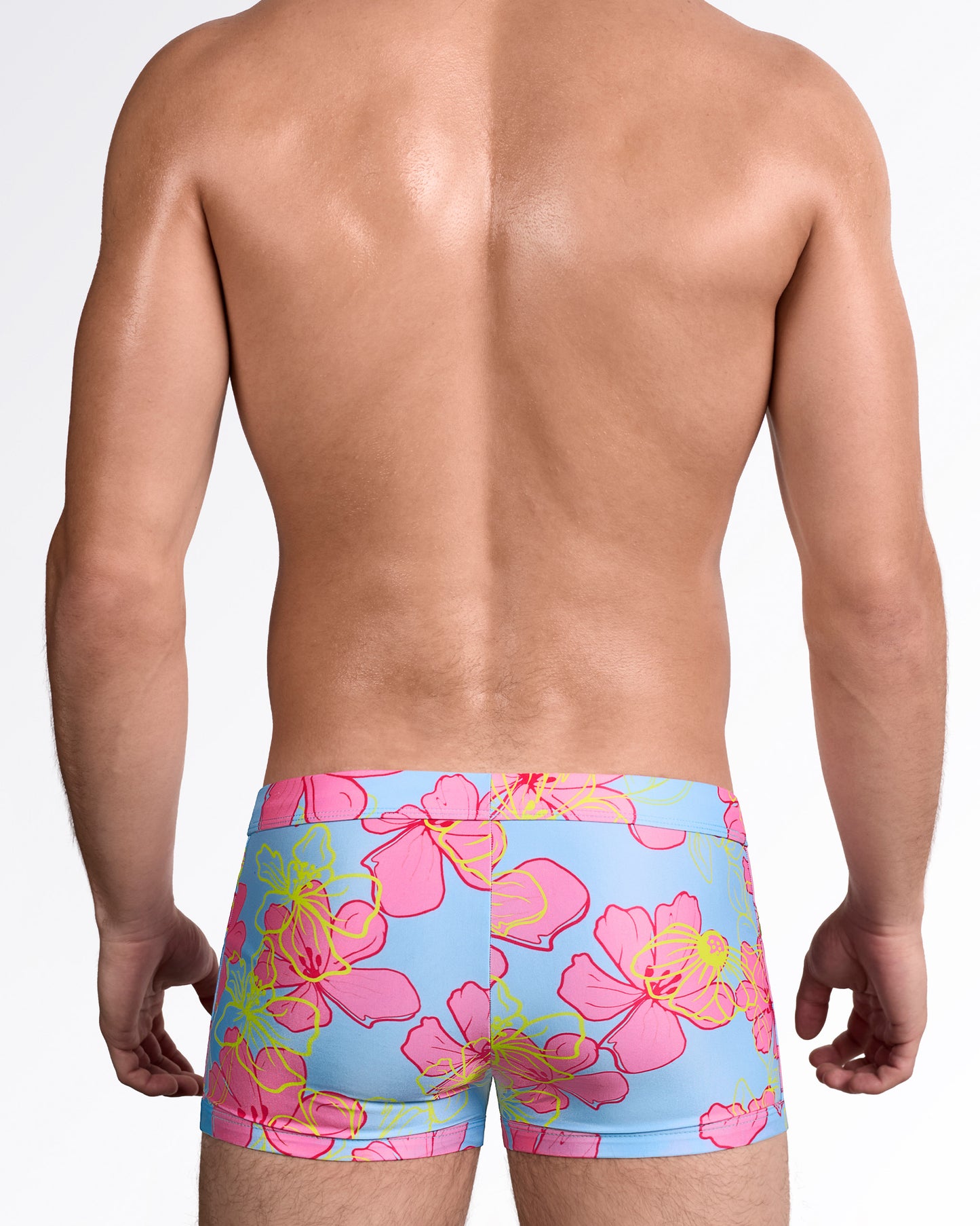 BANG Surf Flowers (Pink/Blue) Swim Trunk — back view showing full trunk coverage with bold allover tropical floral print and clean seam construction.