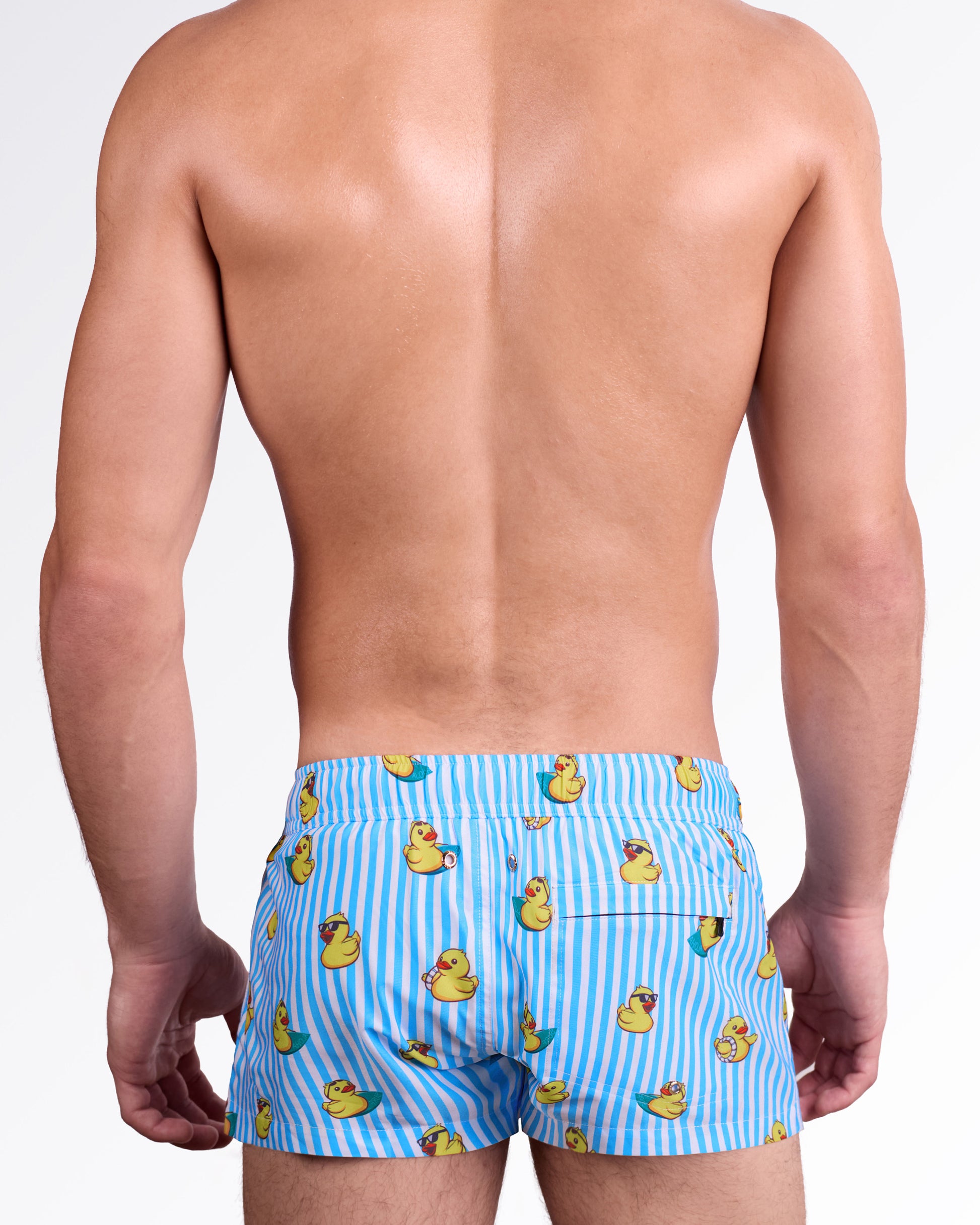 BANG Ducks Just Wanna Have Fun Mini Shorts — back view showcasing the fun duck pattern, elastic waistband, metal drainage eyelets, and a functional rear pocket for beach-ready style and practicality.