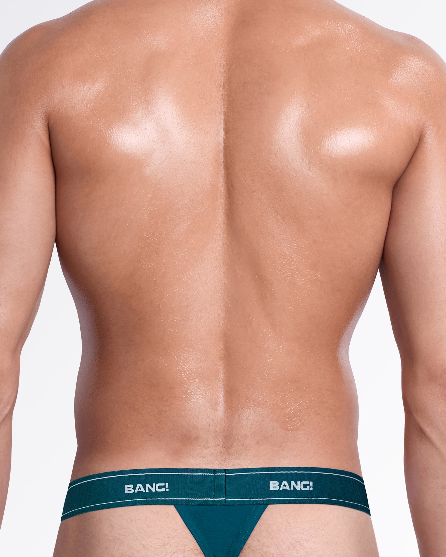 Back view of the Sweet Teals Skin Soft Thong, showing the minimal back coverage and teal elastic logo waistband.