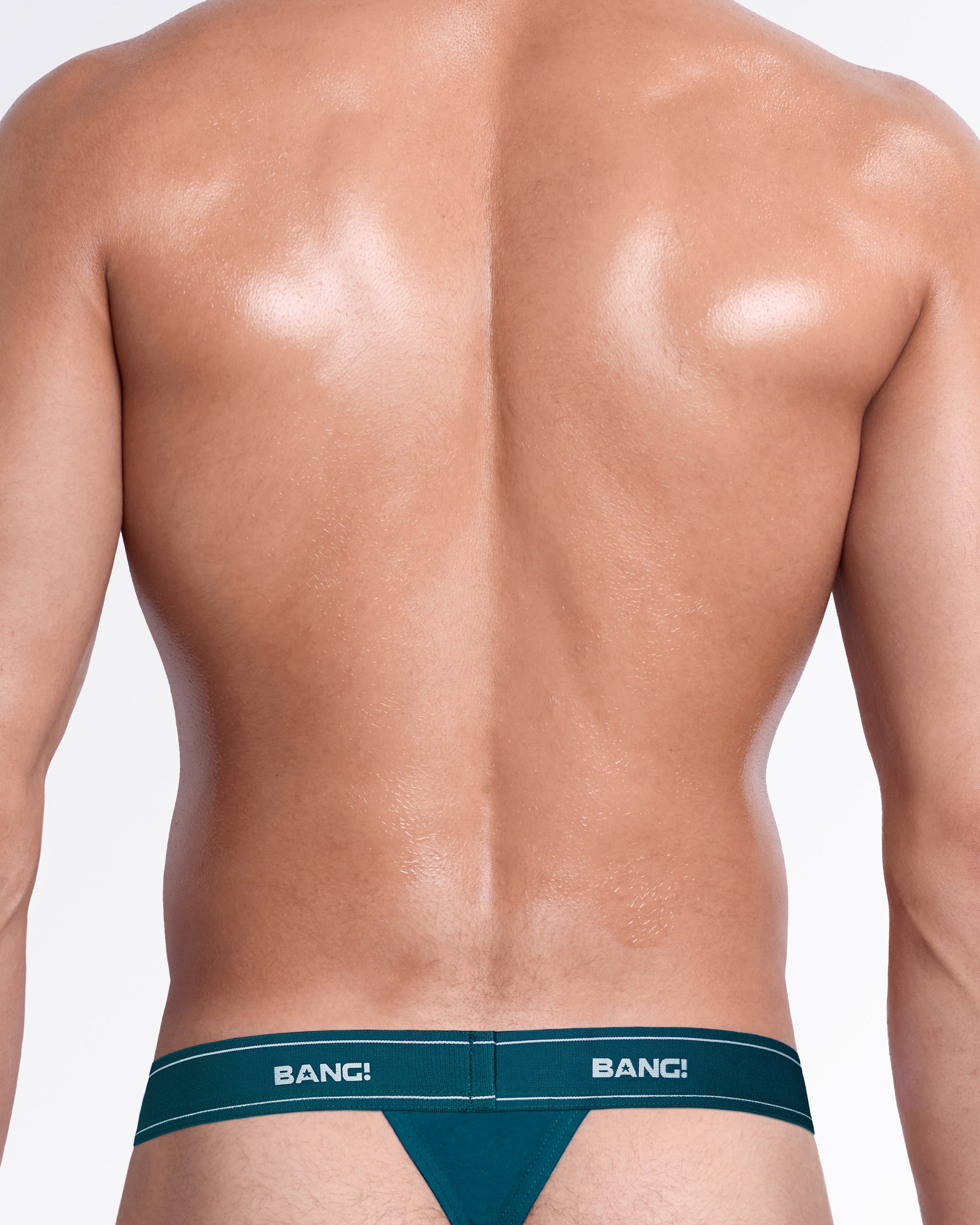 Back view of the Sweet Teals Skin Soft Thong, showing the minimal back coverage and teal elastic logo waistband.