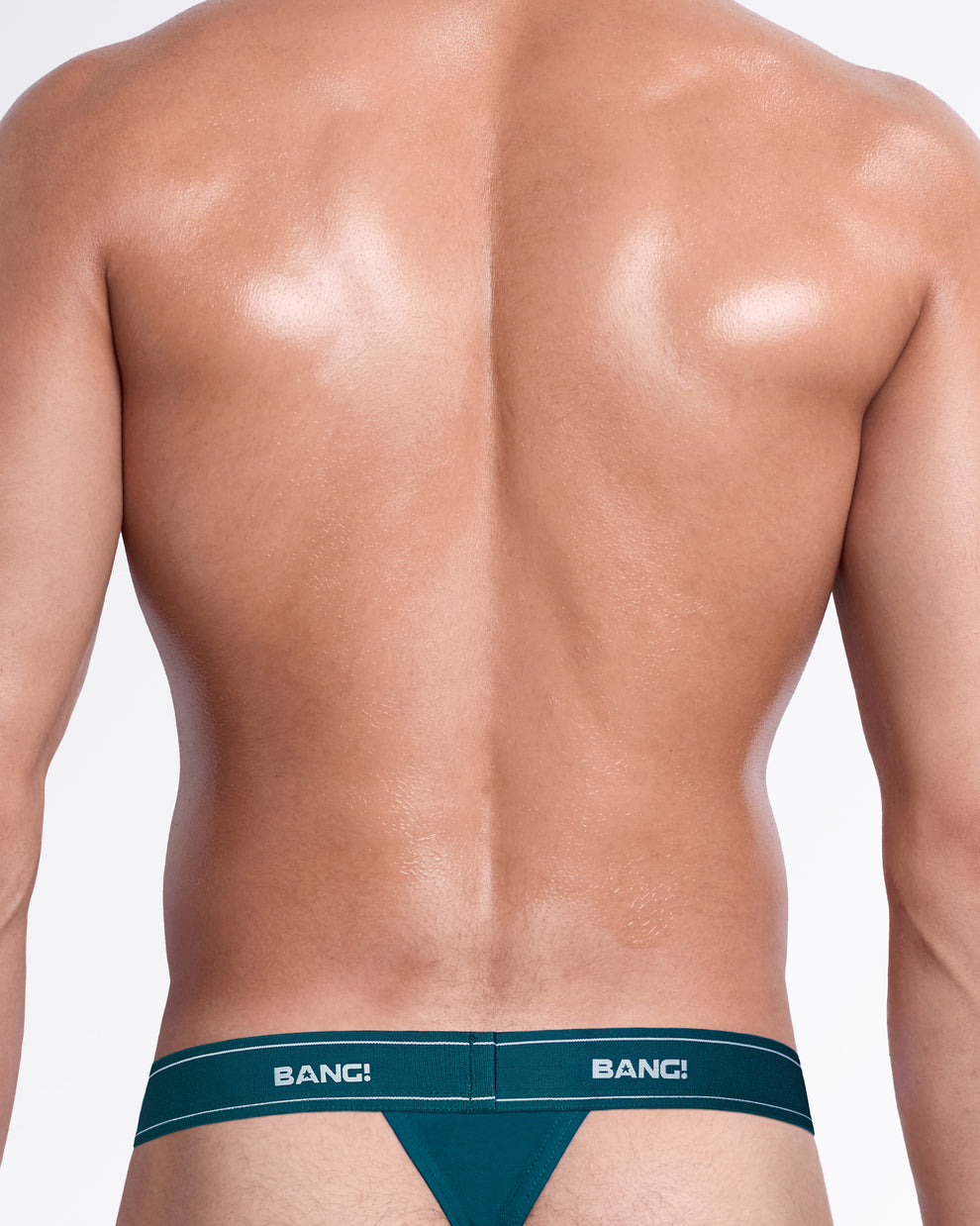 Back view of the Sweet Teals Skin Soft Thong, showing the minimal back coverage and teal elastic logo waistband.