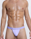 DC2 TAKE MY BREATH AWAY Modal Thong — model front view in lavender with soft waistband and bold statement text.