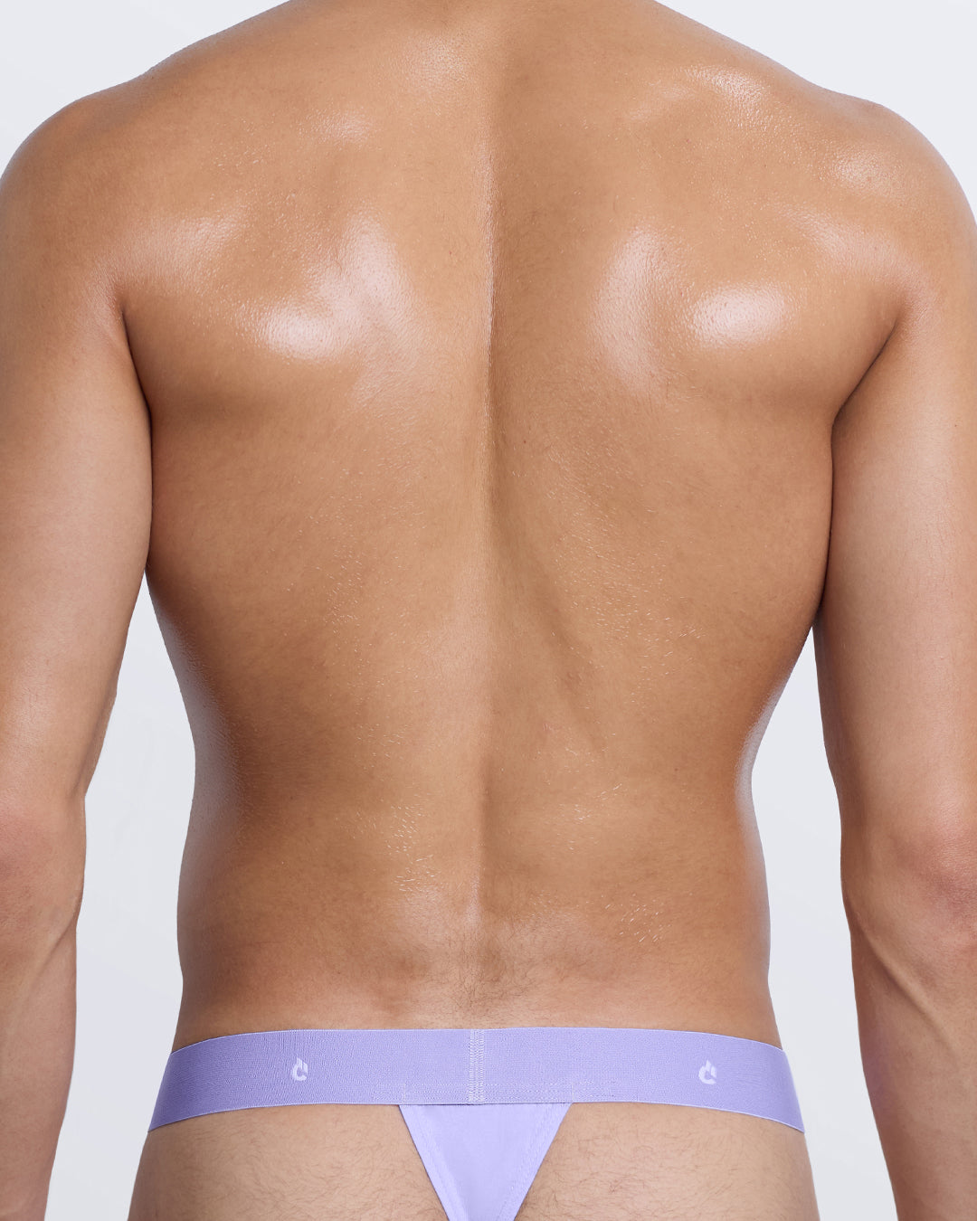 DC2 Modal Thong — back view in pastel lavender with minimal thong fit and tonal waistband featuring DC2 logo.