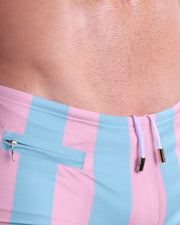 Close-up view of the THE KEN (IBIZA EDITION) men’s drawstring briefs showing white cord with custom branded golden cord ends, and matching custom eyelet trims in gold.