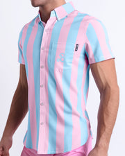 Side view of THE KEN (IBIZA EDITION) Hawaiian-inspired Stretch Shirt for men inspired by the Barbie movie SoBe/Art-Deco-pastels is vibrant with light pink and blue colored stripes designed by BANG! Clothes in Miami.