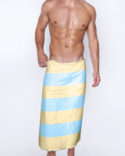 Premium BANG! Clothing  lint-free absorbent towel for the beach and pool in pastel yellow and blue colored stripes by BANG! Clothes based in Miami, Florida. 