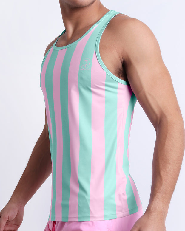 Side view of the THE KEN (MALIBU EDITION) for men’s summer Tank Top. Inspired by the Barbie movie SoBe/Art-Deco-pastels in pink and pastel aqua green stripes, this top is designed by BANG! Clothes in Miami.