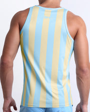 Back view of a male model wearing men’s THE KEN (MIAMI EDITION) beach quick-dry tank top by BANG! Clothes in Miami, featuring pastel yellow and light blue-colored stripes. 