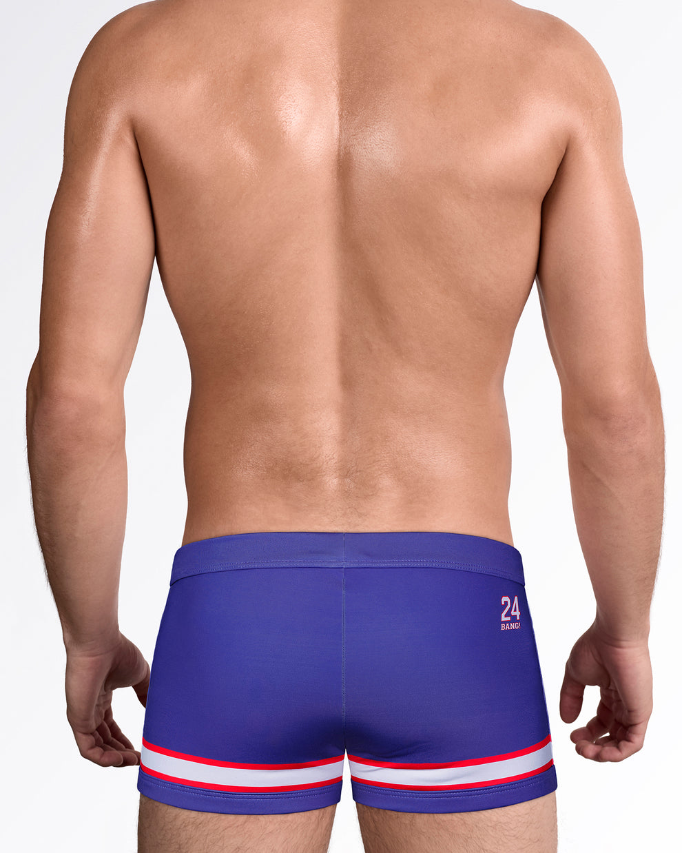Back view of The Shane Swim Trunks showcasing the sleek square-cut fit, contrast stripe hem, and premium men's swimwear design with back logo detail.