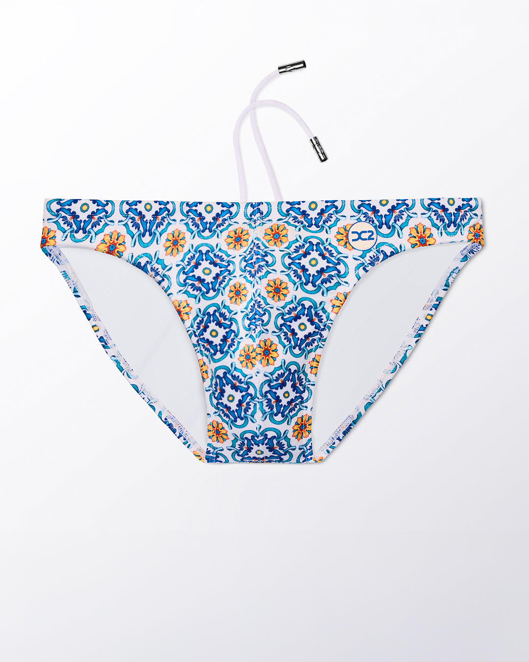 Ghost flat lay of the The Tile Is High Swim Mini Brief, highlighting the tile-inspired pattern, contoured front, and minimal coverage fit.