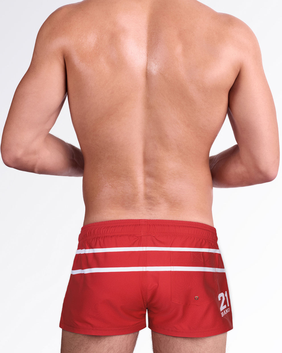 Men's red show shorts inspired by classic hockey uniforms, featuring white stripe accents, rear pocket detail, and a vintage sportswear aesthetic.
