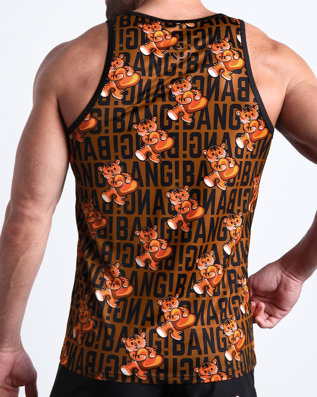 Back view of male model wearing the TIGER HEARTS summer tank top for men by BANG! Miami in brown with orange tigers holding a heart pop art artwork.