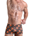 Frontal view of a sexy male model wearing men's swimsuit with mini pockets in TIGER HEARTS  featuring Brown with Orange Tigers pop art designed by the Bang! Menswear brand from Miami.